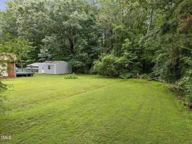 1785 Mitchells Chapel Rd, Pittsboro, NC 27312 - view of grassy yard featuring an outdoor structure and a view of trees