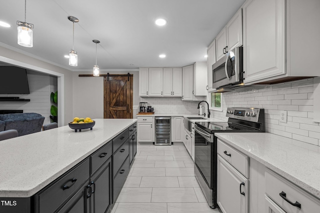 1785 Mitchells Chapel Rd, Pittsboro, NC 27312 - kitchen with appliances with stainless steel finishes, beverage cooler, white cabinetry, a barn door, and recessed lighting