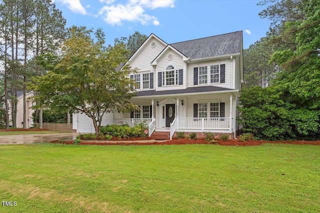 1817 Foxbrook Dr, Raleigh, NC 27603 - view of front of house with covered porch, driveway, a front yard, and roof with shingles