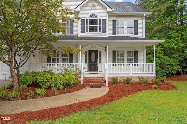 1817 Foxbrook Dr, Raleigh, NC 27603 - view of front of property featuring covered porch, a front yard, and a shingled roof