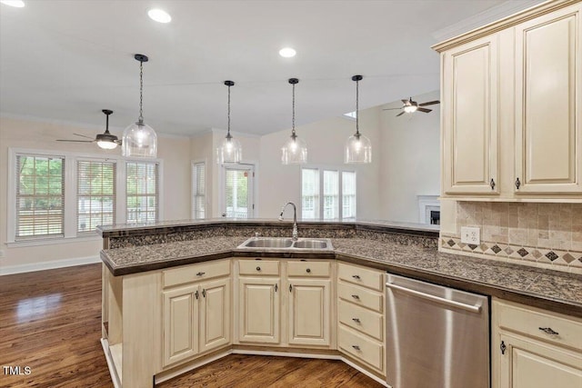 1817 Foxbrook Dr, Raleigh, NC 27603 - kitchen with stainless steel dishwasher, ceiling fan, a sink, cream cabinetry, and recessed lighting