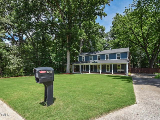 1215 Brookgreen Dr, Cary, NC 27511 - colonial inspired home featuring covered porch and view of scattered trees