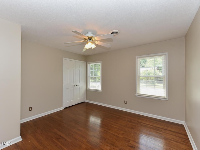 1215 Brookgreen Dr, Cary, NC 27511 - empty room featuring wood finished floors, healthy amount of natural light, baseboards, and a ceiling fan