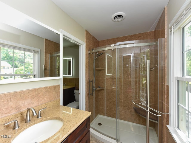 1215 Brookgreen Dr, Cary, NC 27511 - full bathroom with healthy amount of natural light, vanity, toilet, and a shower stall