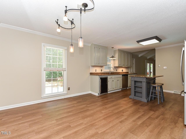 1215 Brookgreen Dr, Cary, NC 27511 - kitchen with dishwasher, open shelves, light wood-style floors, baseboards, and ornamental molding