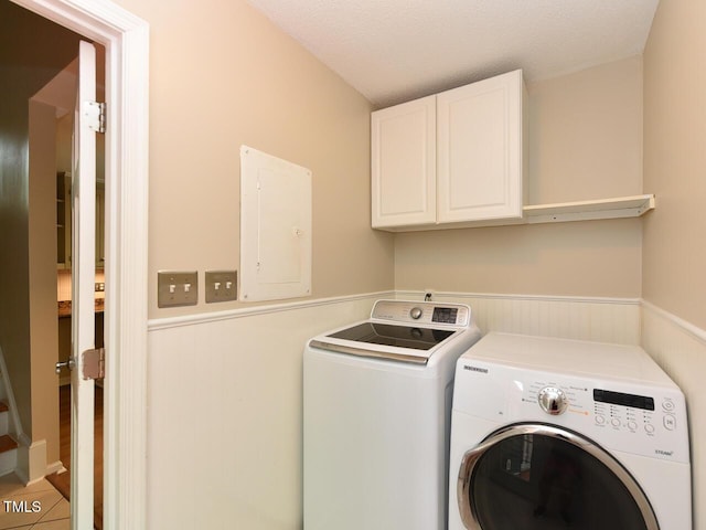 1215 Brookgreen Dr, Cary, NC 27511 - laundry room featuring electric panel, separate washer and dryer, cabinet space, and a wainscoted wall