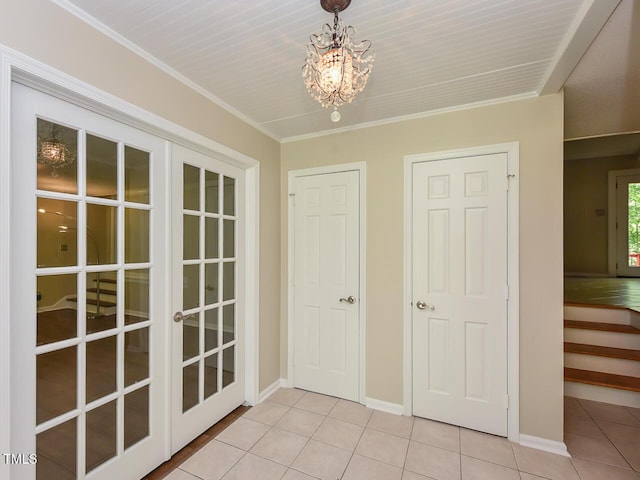 1215 Brookgreen Dr, Cary, NC 27511 - unfurnished dining area featuring light tile patterned floors, a chandelier, french doors, and baseboards
