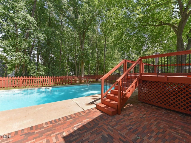 1215 Brookgreen Dr, Cary, NC 27511 - view of swimming pool featuring stairway, a deck, and a patio