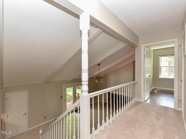 1215 Brookgreen Dr, Cary, NC 27511 - hall featuring plenty of natural light, a textured ceiling, beam ceiling, an upstairs landing, and baseboards