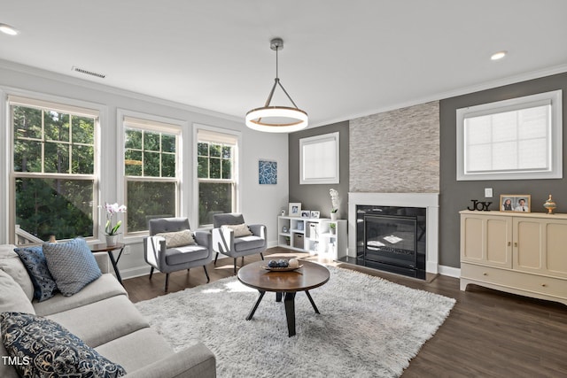 98 Stone Bridge Xing Unit 98, Chapel Hill, NC 27517 - living area featuring crown molding, a large fireplace, baseboards, dark wood-style floors, and recessed lighting