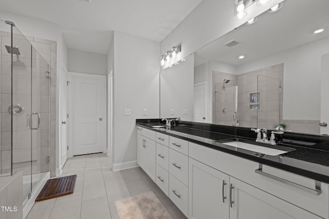 98 Stone Bridge Xing Unit 98, Chapel Hill, NC 27517 - bathroom with double vanity, a shower stall, tile patterned flooring, baseboards, and recessed lighting