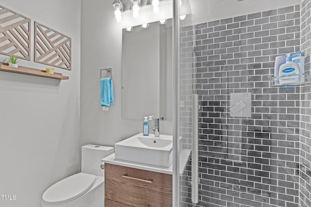98 Stone Bridge Xing Unit 98, Chapel Hill, NC 27517 - full bathroom featuring vanity, a tile shower, and toilet