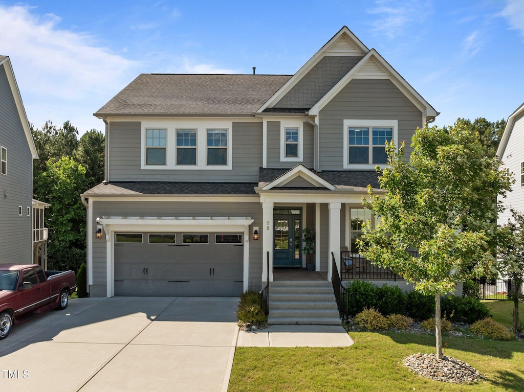 98 Stone Bridge Xing Unit 98, Chapel Hill, NC 27517 - craftsman inspired home featuring a porch, concrete driveway, roof with shingles, and an attached garage