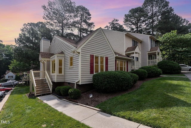 6516 Hearthstone Dr Unit 6516, Raleigh, NC 27615 - view of front of home with a lawn and a chimney