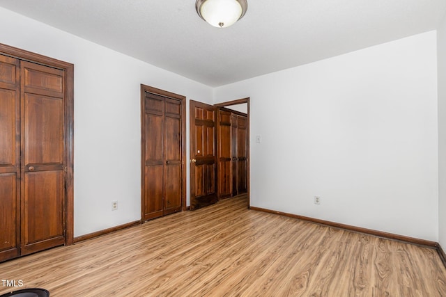6516 Hearthstone Dr Unit 6516, Raleigh, NC 27615 - unfurnished bedroom with light wood-type flooring and baseboards