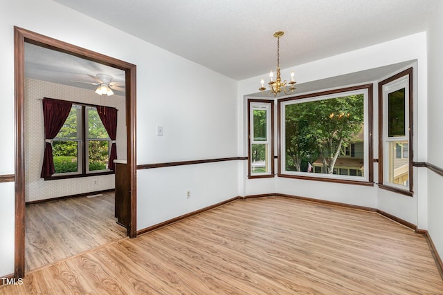 6516 Hearthstone Dr Unit 6516, Raleigh, NC 27615 - unfurnished room featuring light wood-type flooring, a chandelier, baseboards, and a ceiling fan