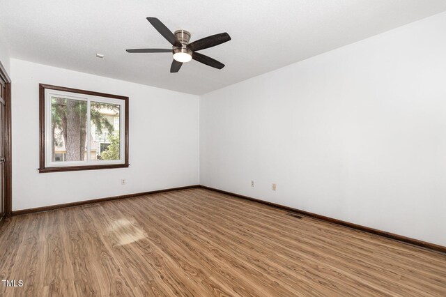 6516 Hearthstone Dr Unit 6516, Raleigh, NC 27615 - unfurnished room featuring light wood-type flooring, baseboards, and a ceiling fan