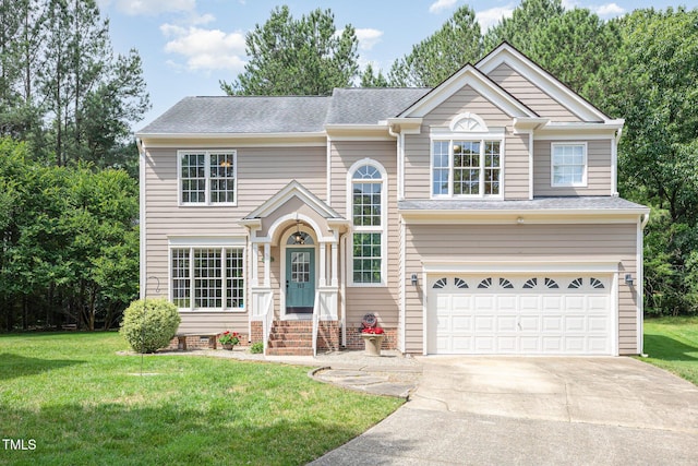 113 Paladin Pl, Cary, NC 27513 - traditional-style house featuring driveway, an attached garage, a front yard, and a shingled roof
