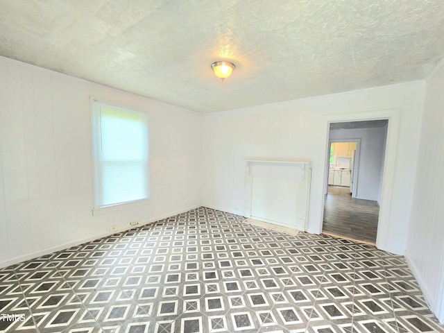 1109 N George St, Goldsboro, NC 27530 - spare room featuring tile patterned floors and a textured ceiling