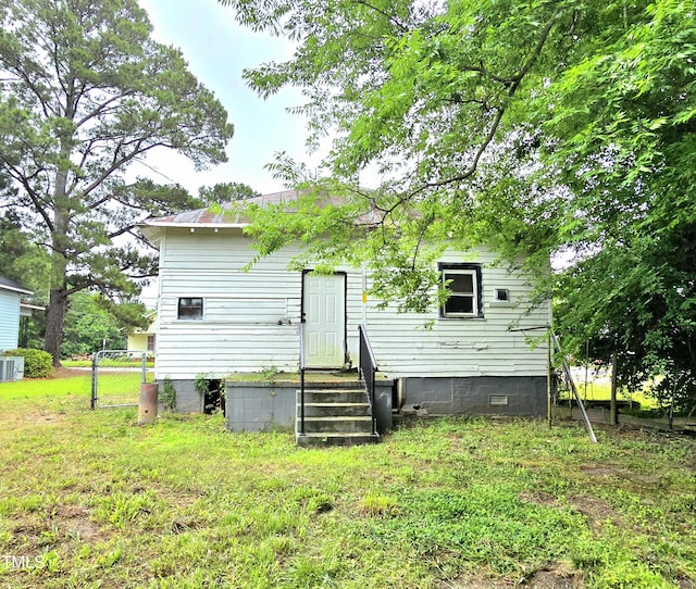 1109 N George St, Goldsboro, NC 27530 - rear view of property featuring crawl space and cooling unit