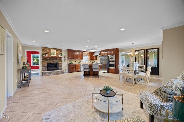1973 Elon Ossipee Rd, Elon, NC 27244 - living area featuring a chandelier, crown molding, recessed lighting, light tile patterned flooring, and baseboards
