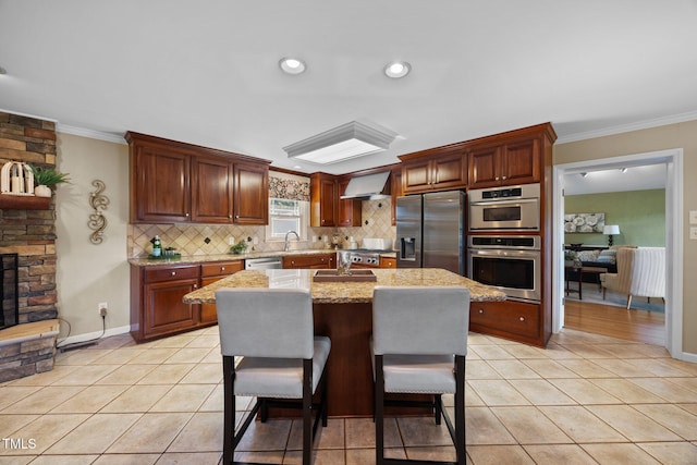 1973 Elon Ossipee Rd, Elon, NC 27244 - kitchen featuring stainless steel appliances, backsplash, ornamental molding, a center island, and light tile patterned floors