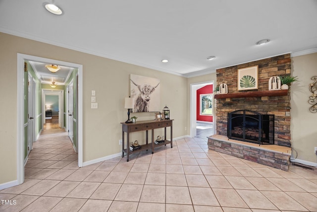 1973 Elon Ossipee Rd, Elon, NC 27244 - living room featuring crown molding, light tile patterned floors, a stone fireplace, baseboards, and recessed lighting