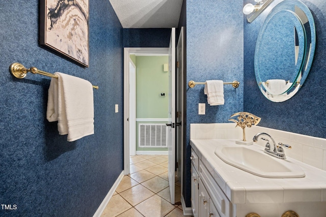 1973 Elon Ossipee Rd, Elon, NC 27244 - bathroom with vanity, tile patterned flooring, and baseboards