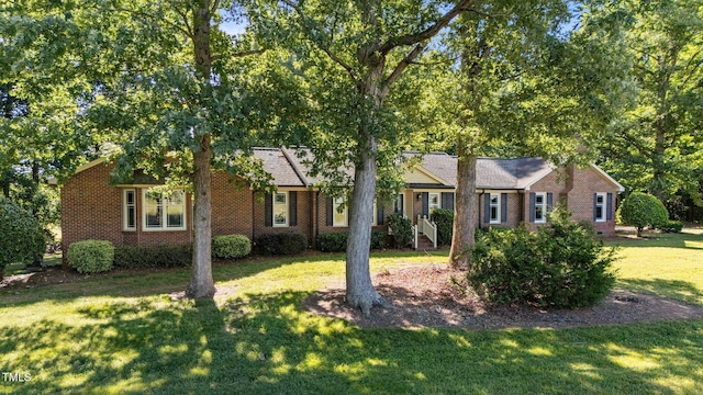 1973 Elon Ossipee Rd, Elon, NC 27244 - single story home with a front lawn and brick siding