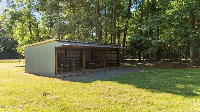 1973 Elon Ossipee Rd, Elon, NC 27244 - view of pole building with a lawn and a detached carport