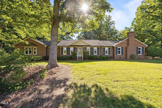 1973 Elon Ossipee Rd, Elon, NC 27244 - ranch-style house with a front lawn, crawl space, a chimney, and brick siding