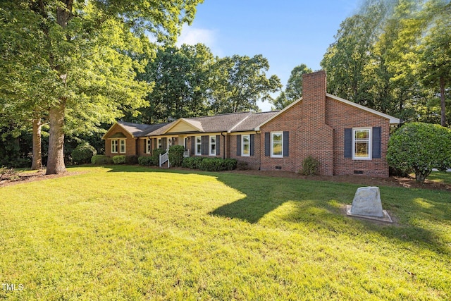 1973 Elon Ossipee Rd, Elon, NC 27244 - ranch-style home with crawl space, a chimney, a front lawn, and brick siding