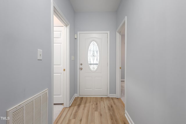 1510 Bungalow Ave, Durham, NC 27703 - doorway featuring light wood finished floors and baseboards