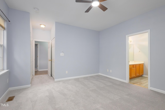 1510 Bungalow Ave, Durham, NC 27703 - unfurnished bedroom featuring light carpet, baseboards, and ensuite bath