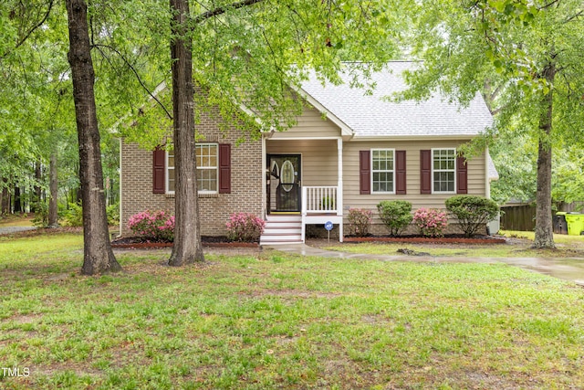 1510 Bungalow Ave, Durham, NC 27703 - view of front of house featuring a front lawn, a porch, and roof with shingles