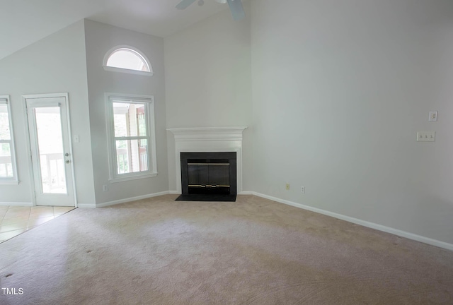 115 Abingdon Ct Unit 2B, Cary, NC 27513 - unfurnished living room featuring light carpet, high vaulted ceiling, baseboards, a fireplace with flush hearth, and ceiling fan