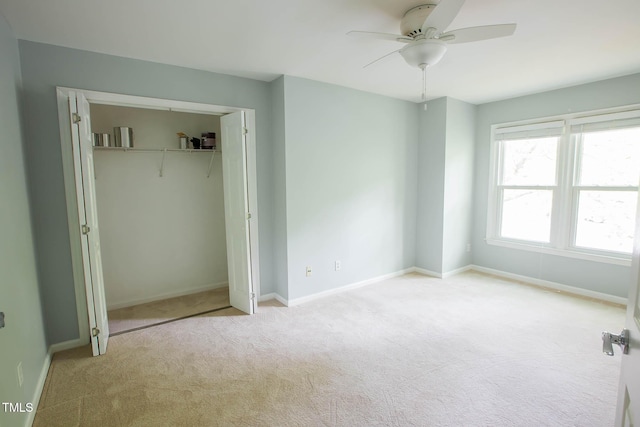 115 Abingdon Ct Unit 2B, Cary, NC 27513 - unfurnished bedroom with carpet, baseboards, a closet, and a ceiling fan