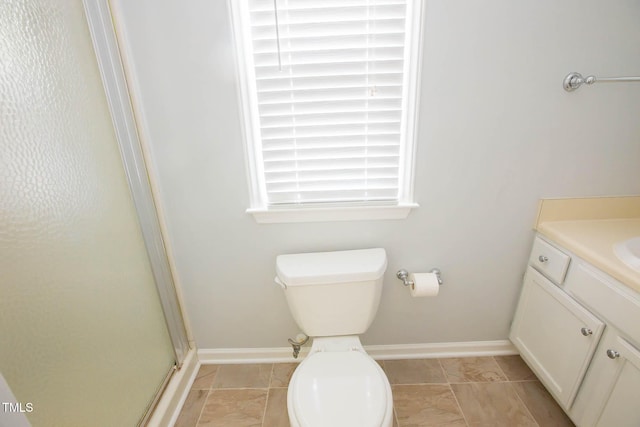 115 Abingdon Ct Unit 2B, Cary, NC 27513 - full bathroom with a stall shower, toilet, vanity, and baseboards