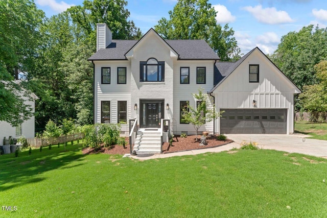 4408 Queenstown Ct, Raleigh, NC 27612 - view of front of home featuring a chimney, board and batten siding, driveway, a garage, and roof with shingles