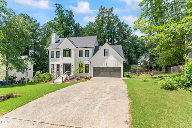 4408 Queenstown Ct, Raleigh, NC 27612 - view of front facade featuring board and batten siding, driveway, a chimney, and roof with shingles