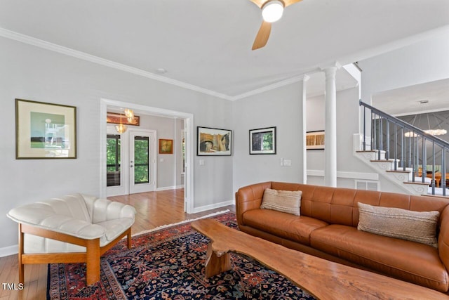 4408 Queenstown Ct, Raleigh, NC 27612 - living area with wood finished floors, baseboards, crown molding, ceiling fan, and stairs