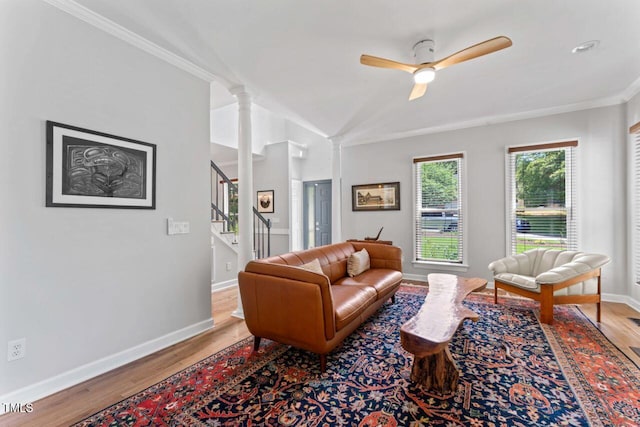 4408 Queenstown Ct, Raleigh, NC 27612 - living room featuring crown molding, wood finished floors, stairs, ceiling fan, and baseboards