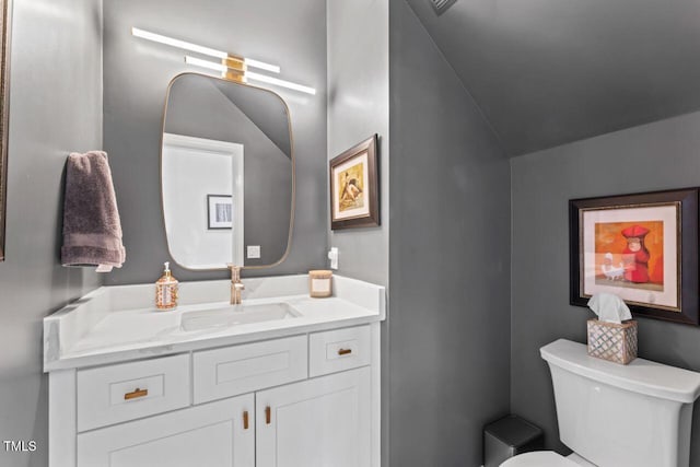 4408 Queenstown Ct, Raleigh, NC 27612 - half bath with toilet, vaulted ceiling, and vanity