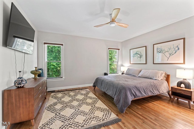4408 Queenstown Ct, Raleigh, NC 27612 - bedroom featuring light wood finished floors, baseboards, and a ceiling fan