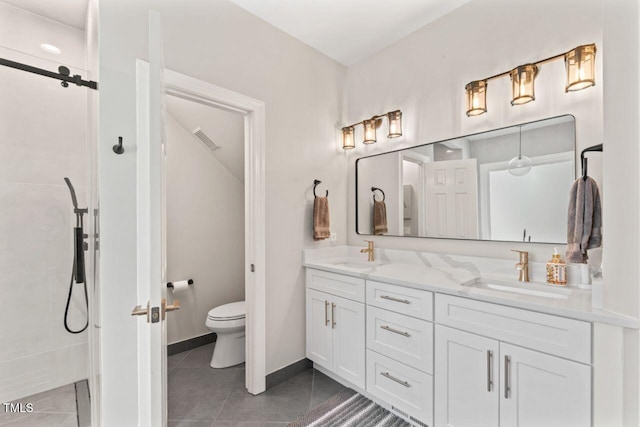 4408 Queenstown Ct, Raleigh, NC 27612 - bathroom featuring double vanity, toilet, walk in shower, tile patterned floors, and baseboards