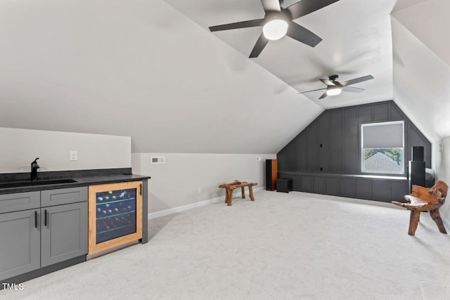 4408 Queenstown Ct, Raleigh, NC 27612 - bonus room with beverage cooler, a sink, vaulted ceiling, carpet floors, and ceiling fan