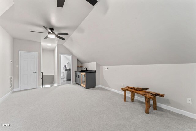 4408 Queenstown Ct, Raleigh, NC 27612 - bonus room featuring a ceiling fan, light carpet, vaulted ceiling, and baseboards