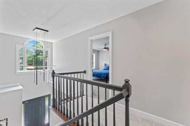 4408 Queenstown Ct, Raleigh, NC 27612 - hall with an upstairs landing, baseboards, and carpet
