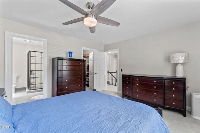4408 Queenstown Ct, Raleigh, NC 27612 - carpeted bedroom with a spacious closet, ensuite bathroom, a ceiling fan, and a closet