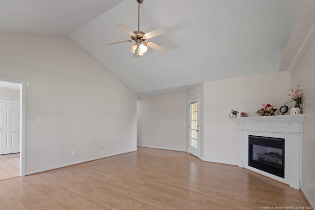 122 Van Buren Dr, Raeford, NC 28376 - unfurnished living room featuring a glass covered fireplace, a ceiling fan, light wood finished floors, and high vaulted ceiling
